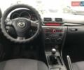 Серый Мазда 3, объемом двигателя 1.6 л и пробегом 220 тыс. км за 5090 $, фото 6 на Automoto.ua