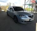 Серый Мазда 3, объемом двигателя 1.6 л и пробегом 305 тыс. км за 4400 $, фото 1 на Automoto.ua