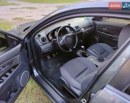 Серый Мазда 3, объемом двигателя 1.6 л и пробегом 193 тыс. км за 6000 $, фото 3 на Automoto.ua