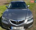 Серый Мазда 3, объемом двигателя 1.6 л и пробегом 318 тыс. км за 5200 $, фото 1 на Automoto.ua