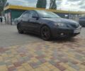 Серый Мазда 3, объемом двигателя 1.6 л и пробегом 299 тыс. км за 6780 $, фото 1 на Automoto.ua