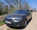 Сірий Мазда 3, об'ємом двигуна 1 л та пробігом 170 тис. км за 3108 $, фото 1 на Automoto.ua