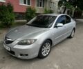 Серый Мазда 3, объемом двигателя 1.6 л и пробегом 245 тыс. км за 2999 $, фото 1 на Automoto.ua