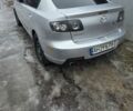 Серый Мазда 3, объемом двигателя 2 л и пробегом 243 тыс. км за 4200 $, фото 1 на Automoto.ua