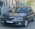 Серый Мазда 3, объемом двигателя 1.6 л и пробегом 299 тыс. км за 5299 $, фото 1 на Automoto.ua