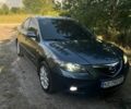 Серый Мазда 3, объемом двигателя 1.6 л и пробегом 204 тыс. км за 5500 $, фото 1 на Automoto.ua