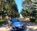 Серый Мазда 3, объемом двигателя 2 л и пробегом 145 тыс. км за 6750 $, фото 1 на Automoto.ua