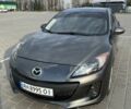 Серый Мазда 3, объемом двигателя 2 л и пробегом 225 тыс. км за 7200 $, фото 1 на Automoto.ua
