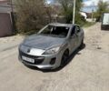 Серый Мазда 3, объемом двигателя 2 л и пробегом 144 тыс. км за 2599 $, фото 1 на Automoto.ua