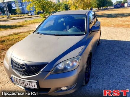 Серый Мазда 3, объемом двигателя 1.6 л и пробегом 296 тыс. км за 4000 $, фото 1 на Automoto.ua