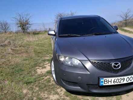 Серый Мазда 3, объемом двигателя 2 л и пробегом 160 тыс. км за 4200 $, фото 1 на Automoto.ua