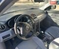 Синий Мазда 3, объемом двигателя 1.4 л и пробегом 256 тыс. км за 4000 $, фото 4 на Automoto.ua