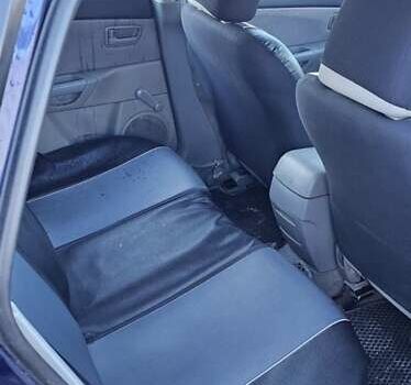 Синий Мазда 3, объемом двигателя 1.56 л и пробегом 360 тыс. км за 4200 $, фото 5 на Automoto.ua