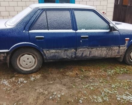 Синий Мазда 3, объемом двигателя 2 л и пробегом 345 тыс. км за 650 $, фото 2 на Automoto.ua