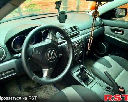 Синий Мазда 3, объемом двигателя 2 л и пробегом 258 тыс. км за 4500 $, фото 1 на Automoto.ua