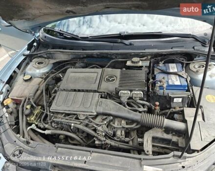 Синий Мазда 3, объемом двигателя 1.6 л и пробегом 206 тыс. км за 5500 $, фото 11 на Automoto.ua