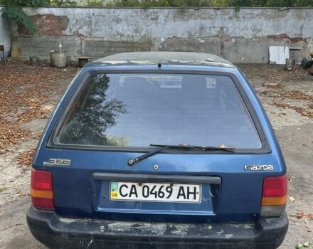 Синий Мазда 3, объемом двигателя 1.8 л и пробегом 300 тыс. км за 750 $, фото 2 на Automoto.ua