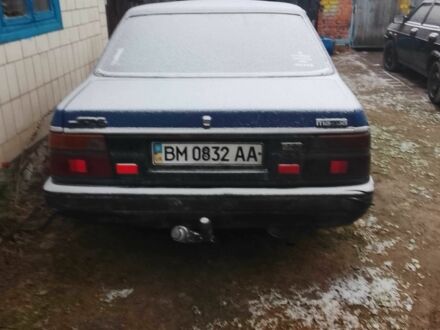 Синий Мазда 3, объемом двигателя 2 л и пробегом 345 тыс. км за 650 $, фото 1 на Automoto.ua