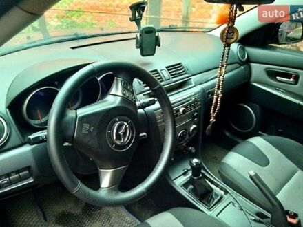 Синий Мазда 3, объемом двигателя 2 л и пробегом 258 тыс. км за 4500 $, фото 1 на Automoto.ua