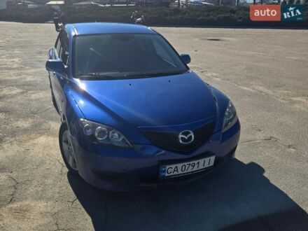 Синий Мазда 3, объемом двигателя 1.35 л и пробегом 235 тыс. км за 4950 $, фото 1 на Automoto.ua