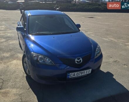 Синий Мазда 3, объемом двигателя 1.35 л и пробегом 235 тыс. км за 4950 $, фото 1 на Automoto.ua