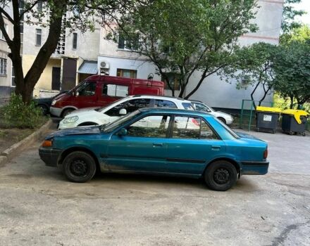 Зеленый Мазда 3, объемом двигателя 1 л и пробегом 420 тыс. км за 797 $, фото 4 на Automoto.ua