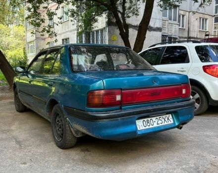 Зеленый Мазда 3, объемом двигателя 1 л и пробегом 420 тыс. км за 797 $, фото 5 на Automoto.ua