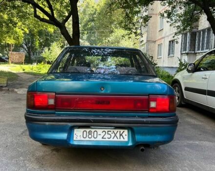 Зеленый Мазда 3, объемом двигателя 1 л и пробегом 420 тыс. км за 797 $, фото 6 на Automoto.ua