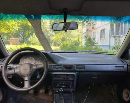 Зеленый Мазда 3, объемом двигателя 1 л и пробегом 420 тыс. км за 797 $, фото 3 на Automoto.ua