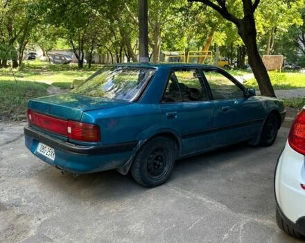 Зеленый Мазда 3, объемом двигателя 1 л и пробегом 420 тыс. км за 797 $, фото 1 на Automoto.ua