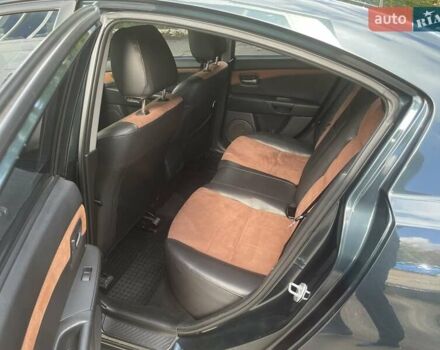 Зеленый Мазда 3, объемом двигателя 2 л и пробегом 176 тыс. км за 5700 $, фото 14 на Automoto.ua