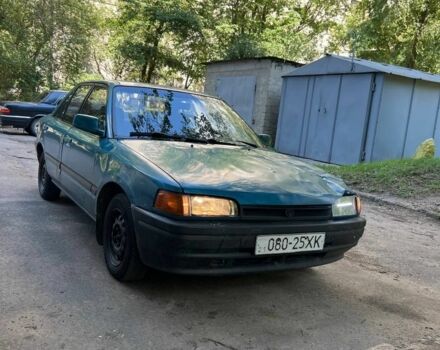 Зеленый Мазда 3, объемом двигателя 1 л и пробегом 420 тыс. км за 797 $, фото 1 на Automoto.ua