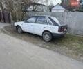 Белый Мазда 323, объемом двигателя 1.3 л и пробегом 100 тыс. км за 500 $, фото 1 на Automoto.ua