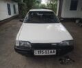 Белый Мазда 323, объемом двигателя 1 л и пробегом 250 тыс. км за 800 $, фото 1 на Automoto.ua