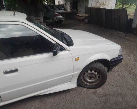 Белый Мазда 323, объемом двигателя 1 л и пробегом 250 тыс. км за 800 $, фото 3 на Automoto.ua