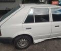 Белый Мазда 323, объемом двигателя 1 л и пробегом 250 тыс. км за 600 $, фото 3 на Automoto.ua