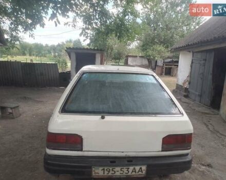 Белый Мазда 323, объемом двигателя 1 л и пробегом 250 тыс. км за 600 $, фото 11 на Automoto.ua