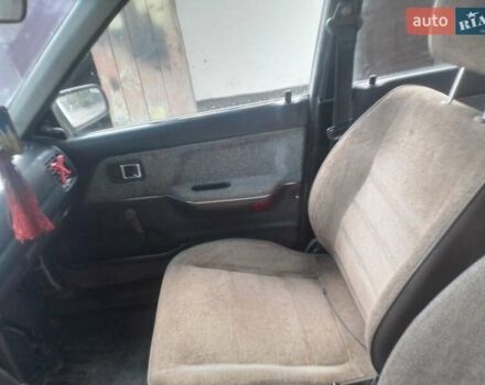 Белый Мазда 323, объемом двигателя 1 л и пробегом 250 тыс. км за 600 $, фото 7 на Automoto.ua