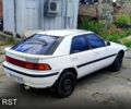 Белый Мазда 323, объемом двигателя 1.8 л и пробегом 150 тыс. км за 899 $, фото 1 на Automoto.ua