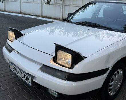 Білий Мазда 323, об'ємом двигуна 1.6 л та пробігом 193 тис. км за 1950 $, фото 2 на Automoto.ua
