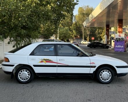Білий Мазда 323, об'ємом двигуна 1.6 л та пробігом 193 тис. км за 1950 $, фото 3 на Automoto.ua