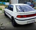 Белый Мазда 323, объемом двигателя 1.8 л и пробегом 150 тыс. км за 700 $, фото 1 на Automoto.ua