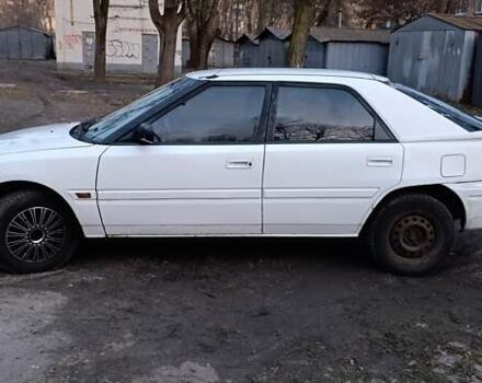 Белый Мазда 323, объемом двигателя 1.6 л и пробегом 469 тыс. км за 1500 $, фото 1 на Automoto.ua