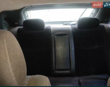 Белый Мазда 323, объемом двигателя 2 л и пробегом 300 тыс. км за 2300 $, фото 2 на Automoto.ua