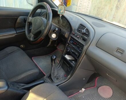 Белый Мазда 323, объемом двигателя 1.5 л и пробегом 380 тыс. км за 1550 $, фото 2 на Automoto.ua