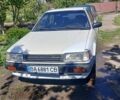 Белый Мазда 323, объемом двигателя 1.5 л и пробегом 300 тыс. км за 911 $, фото 1 на Automoto.ua