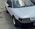 Белый Мазда 323, объемом двигателя 1.5 л и пробегом 100 тыс. км за 600 $, фото 1 на Automoto.ua