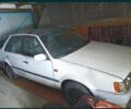 Белый Мазда 323, объемом двигателя 1 л и пробегом 200 тыс. км за 348 $, фото 1 на Automoto.ua