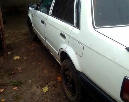 Белый Мазда 323, объемом двигателя 1.3 л и пробегом 100 тыс. км за 750 $, фото 2 на Automoto.ua