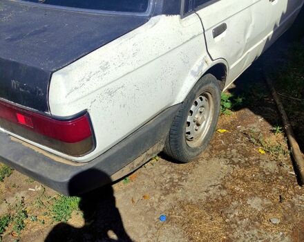 Білий Мазда 323, об'ємом двигуна 1.3 л та пробігом 380 тис. км за 720 $, фото 5 на Automoto.ua